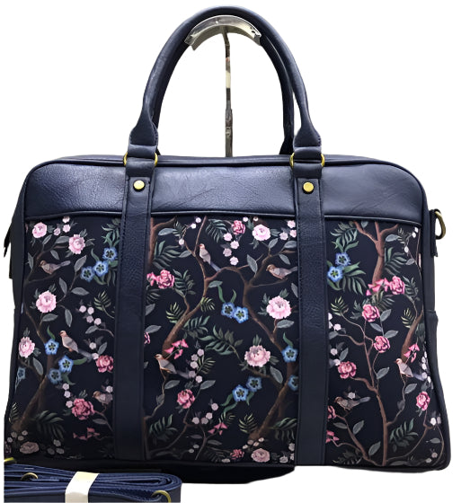 Navy bag with colorful leaf pattern on a white background