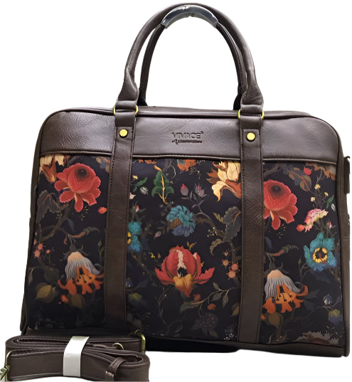 Floral-patterned bag with brown leather straps on a white background