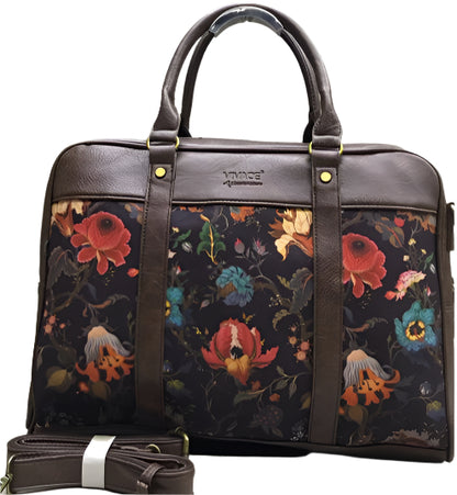 Floral-patterned bag with brown leather straps on a white background