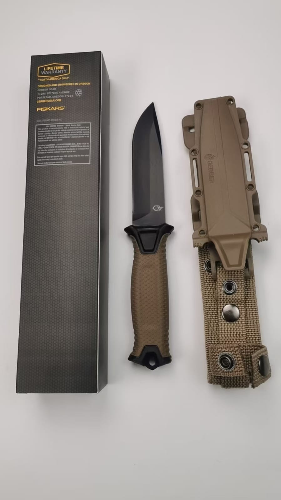 Durable fixed-blade knife with a textured grip handle.