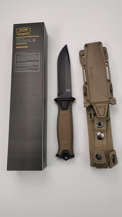 Durable fixed-blade knife with a textured grip handle.