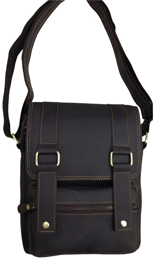 Three views of a brown leather bag with measurements on a light wooden surface.
