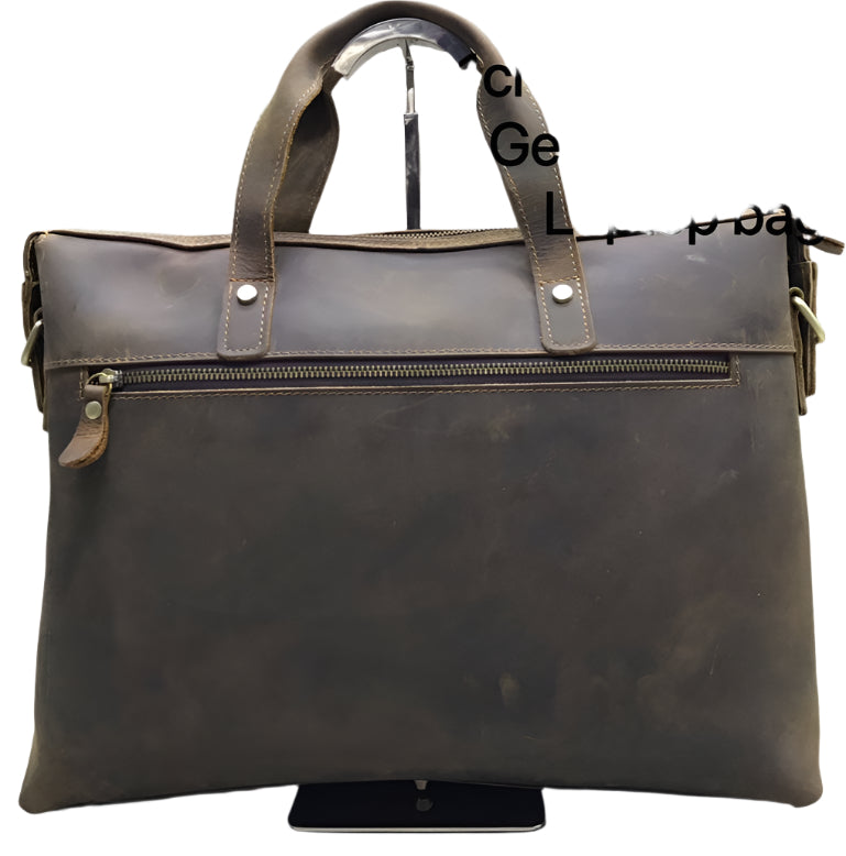 Brown leather bag with gold hardware on a white background
