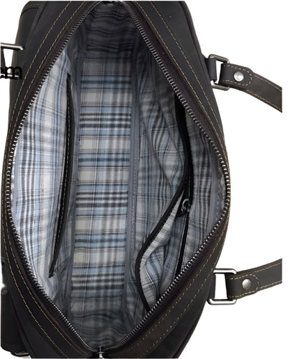 Black leather handbag shown from multiple angles with dimensions and material details on a wooden surface.