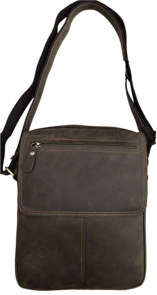 A brown genuine leather sling bag displayed from two angles, showing the front and back, with a shoulder strap and a zipper closure.