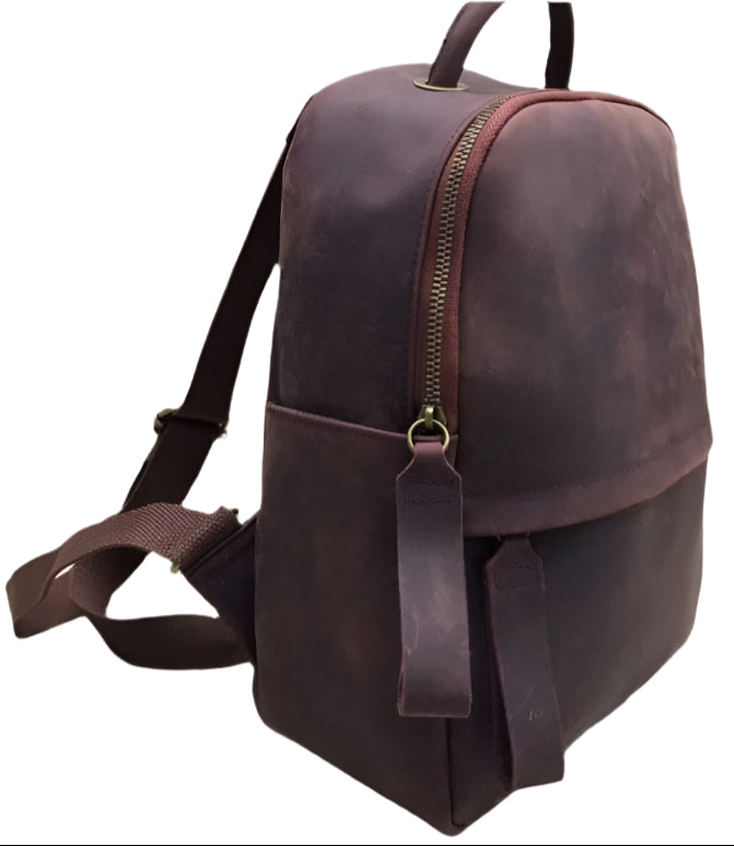 Brown leather backpack shown from multiple angles on a light wooden surface.