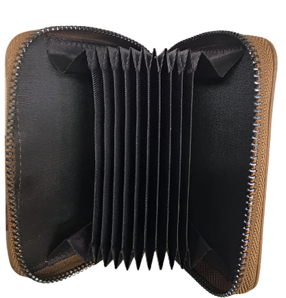 Collection of leather cardholders in black, brown, and maroon on a wooden surface.