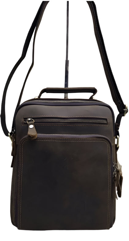 A brown genuine leather sling bag displayed from multiple angles, highlighting the bag's design and zipper detailing.